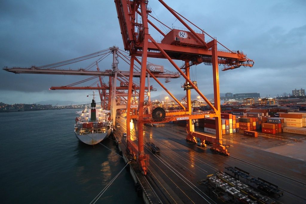 Container cranes at a port at dusk